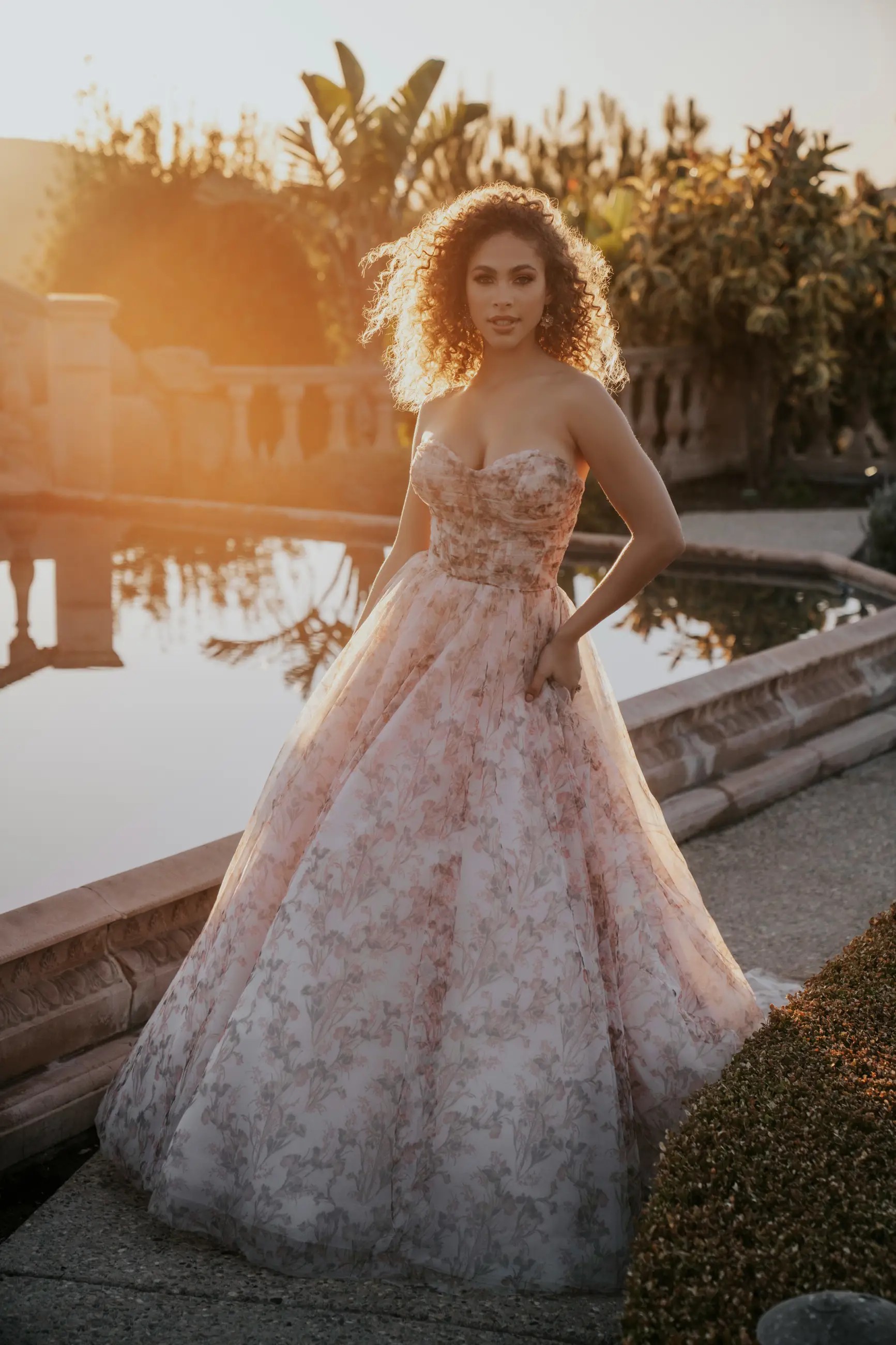 Plus size model wearing a white Maggie Sottero Gown
