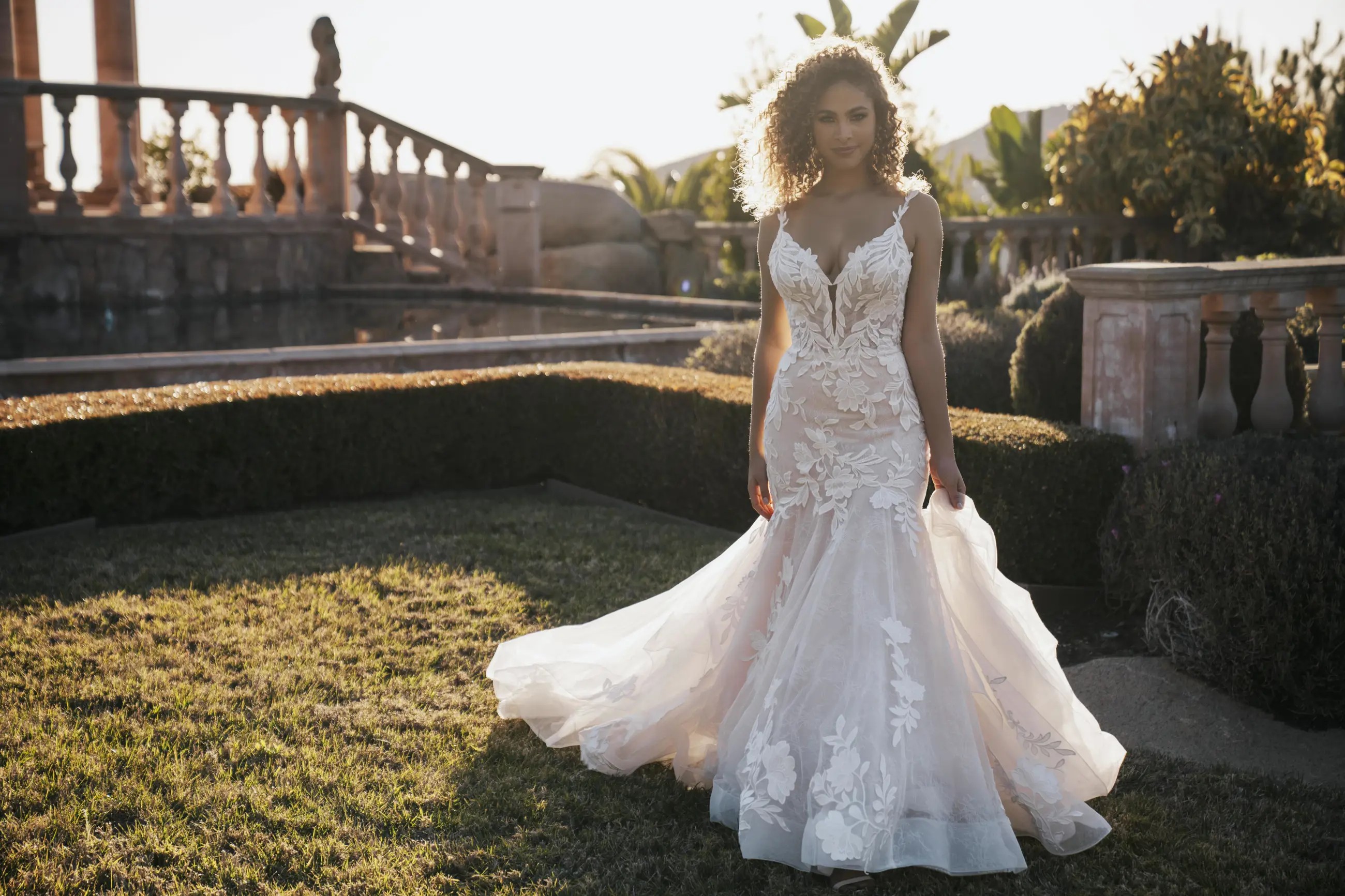Model wearing a white Maggie Sottero Gown