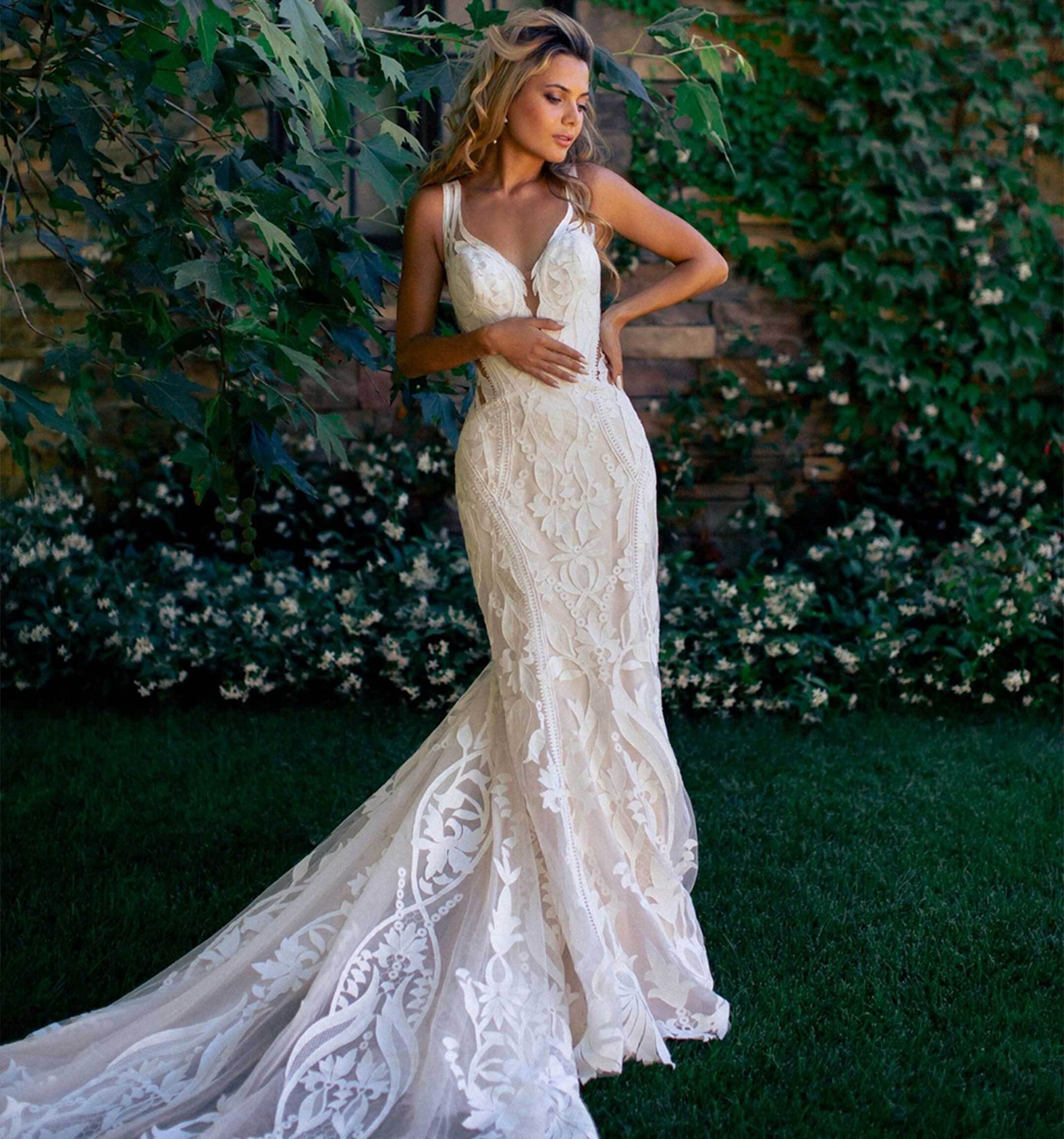 Model wearing a white Rebecca Ingram Dress