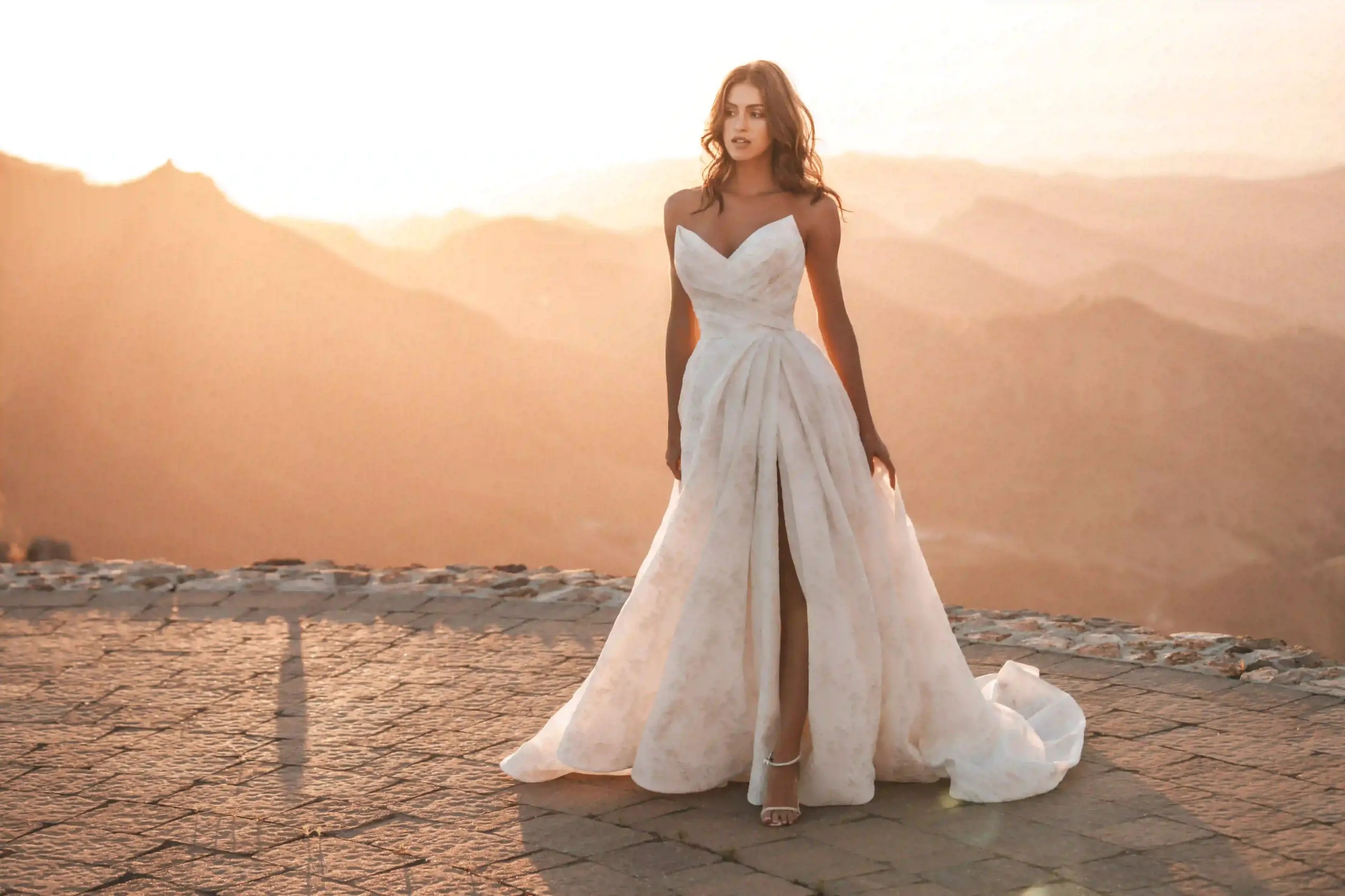 Model wearing a white Allure Gown