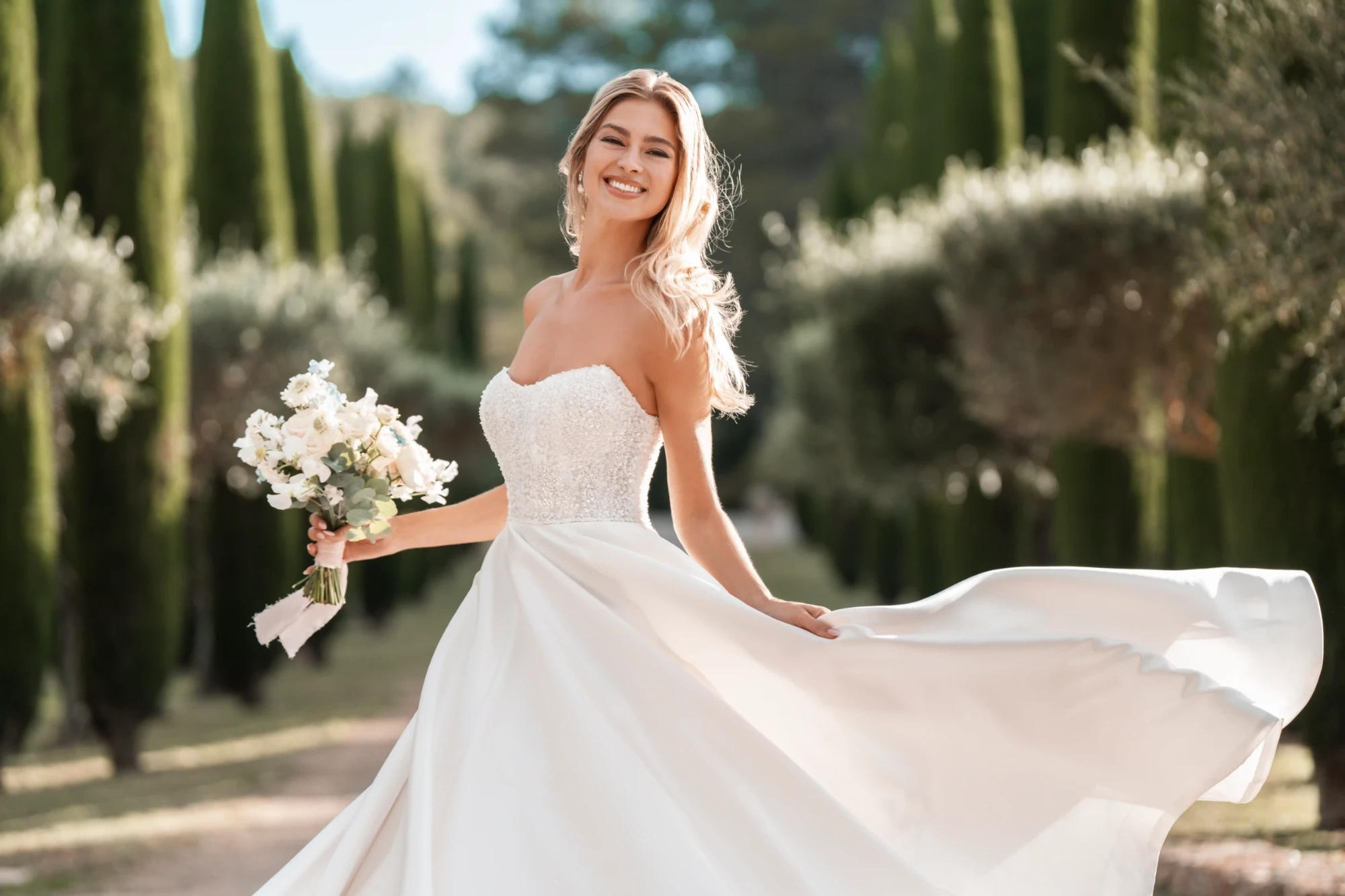 Model wearing a white Allure Gown