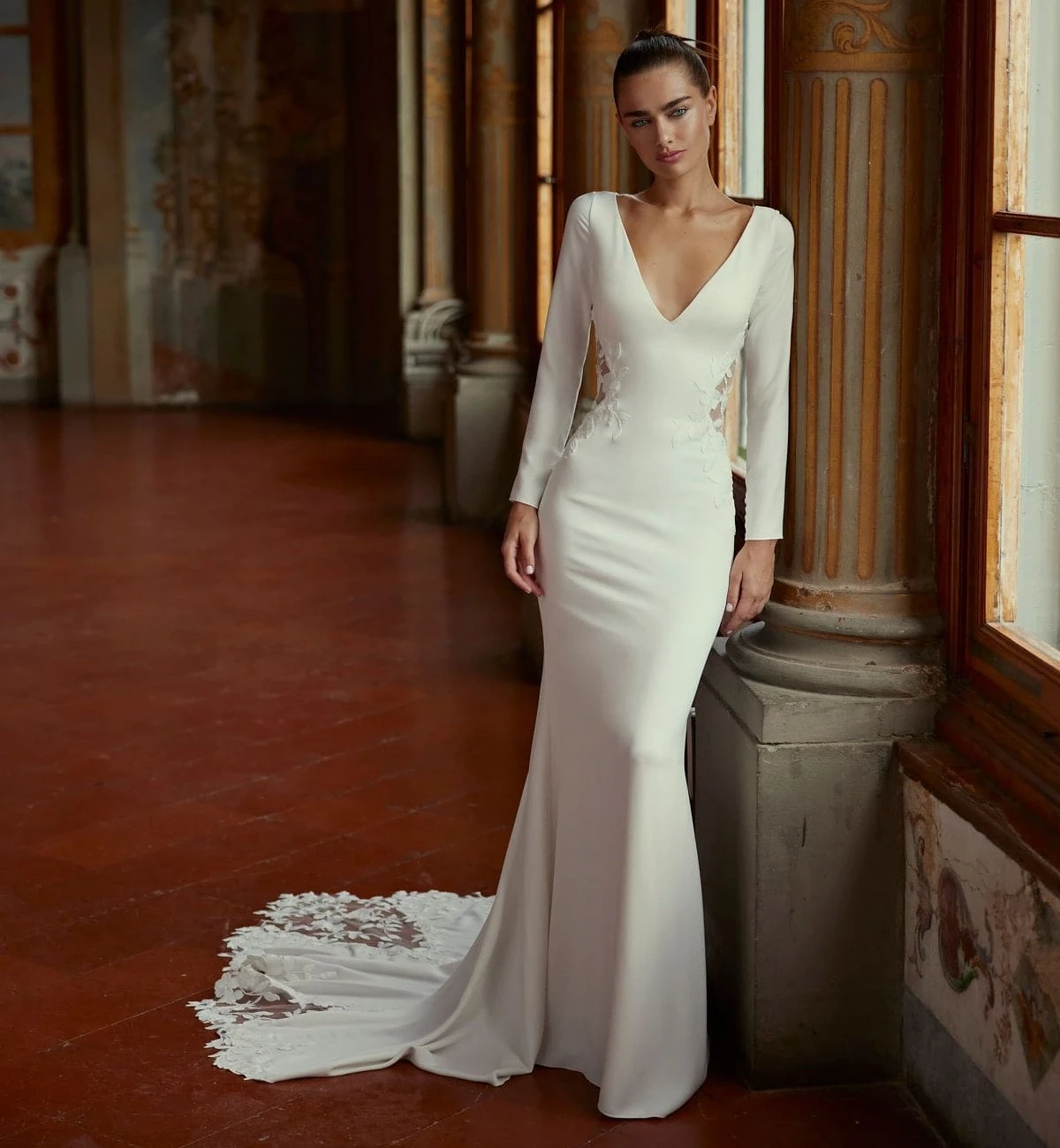 Model wearing a white Long Sleeved Style Dress