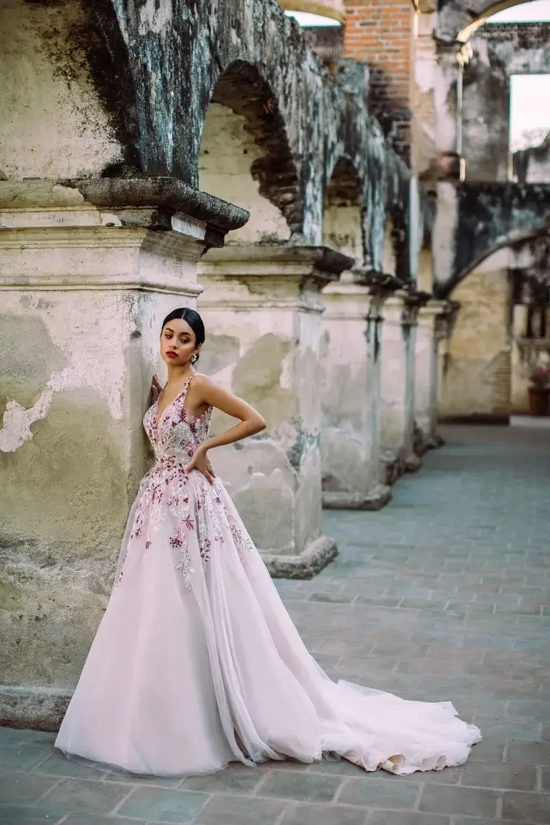 Model is wearing a sleeveless a-line lace wedding dress by allure wilderly bride