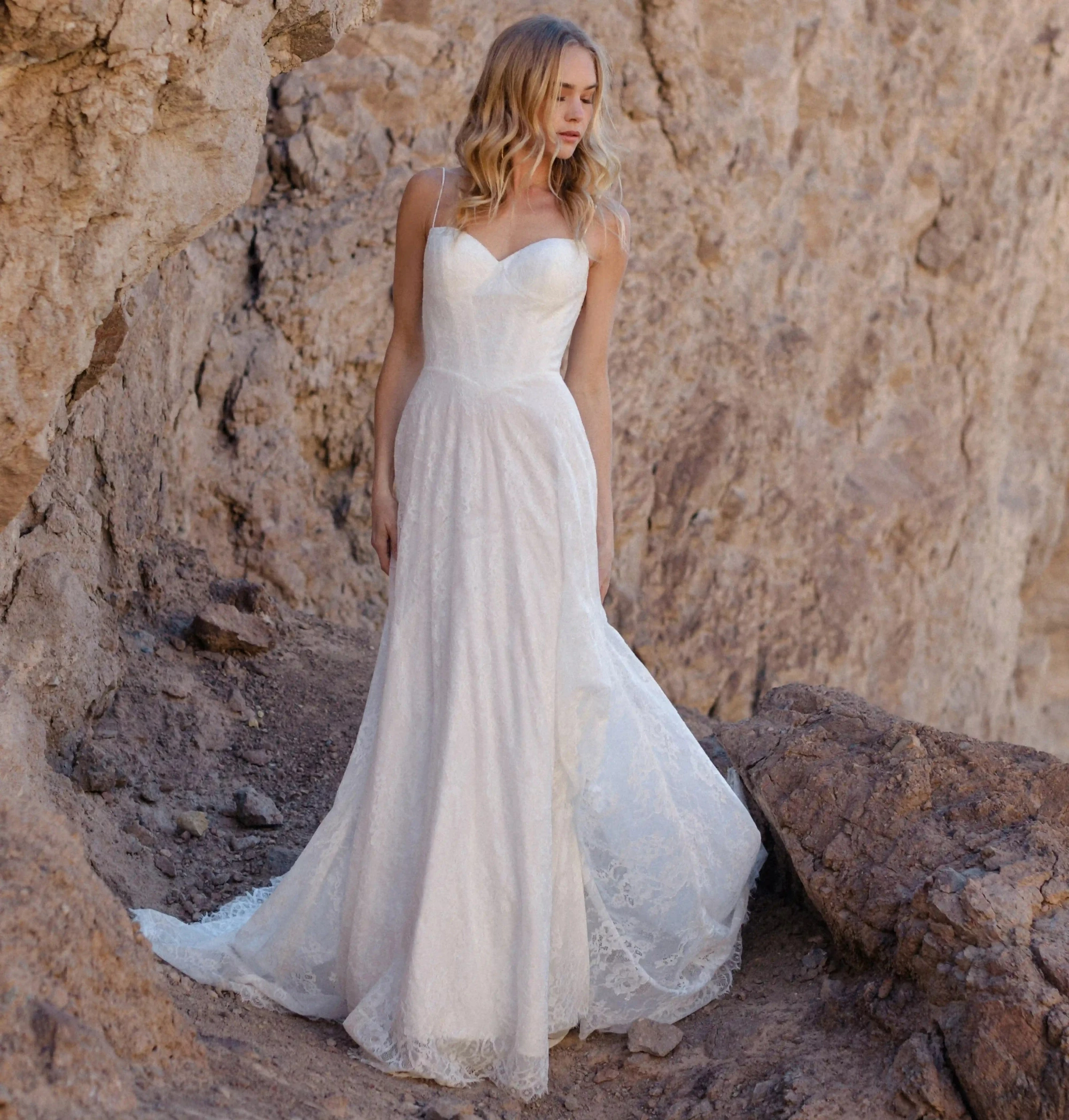 Model wearing a white Allure Wedding Dress