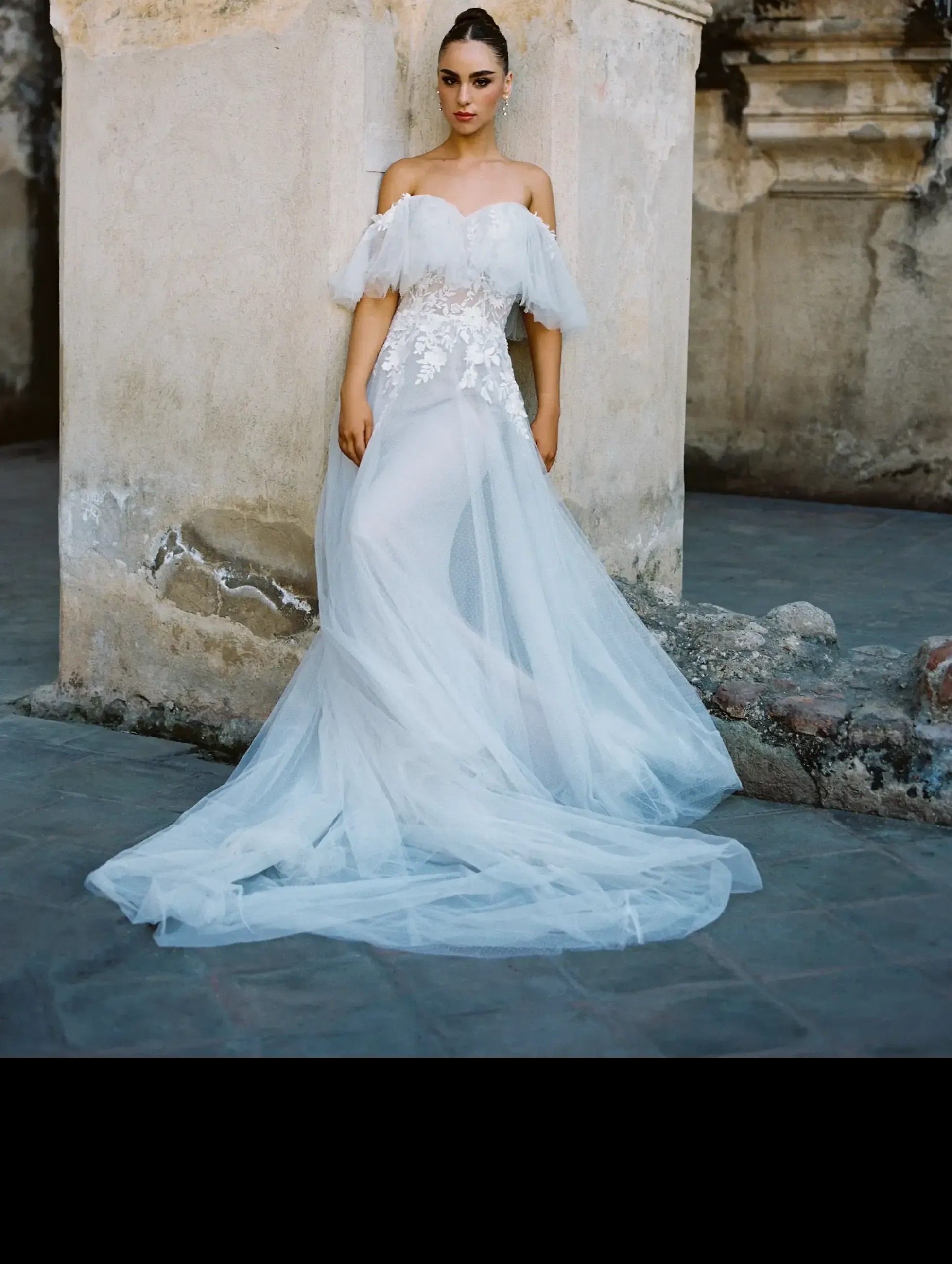 Model wearing a white Capped Sleeves Style Dress