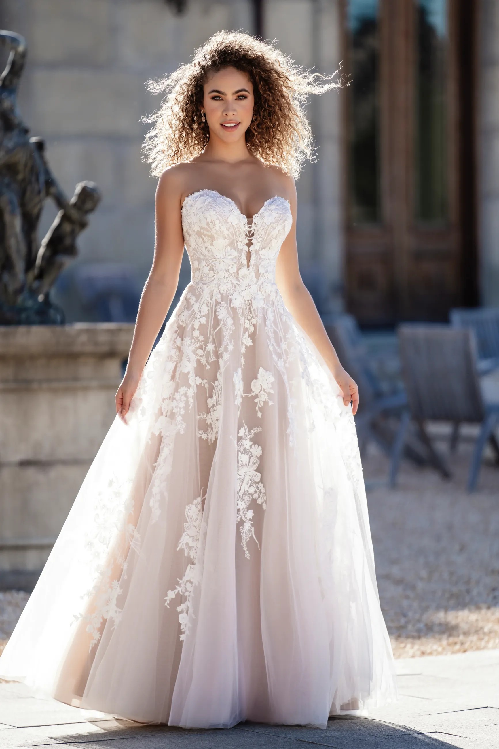 Model wearing a white Strapless Style Dress