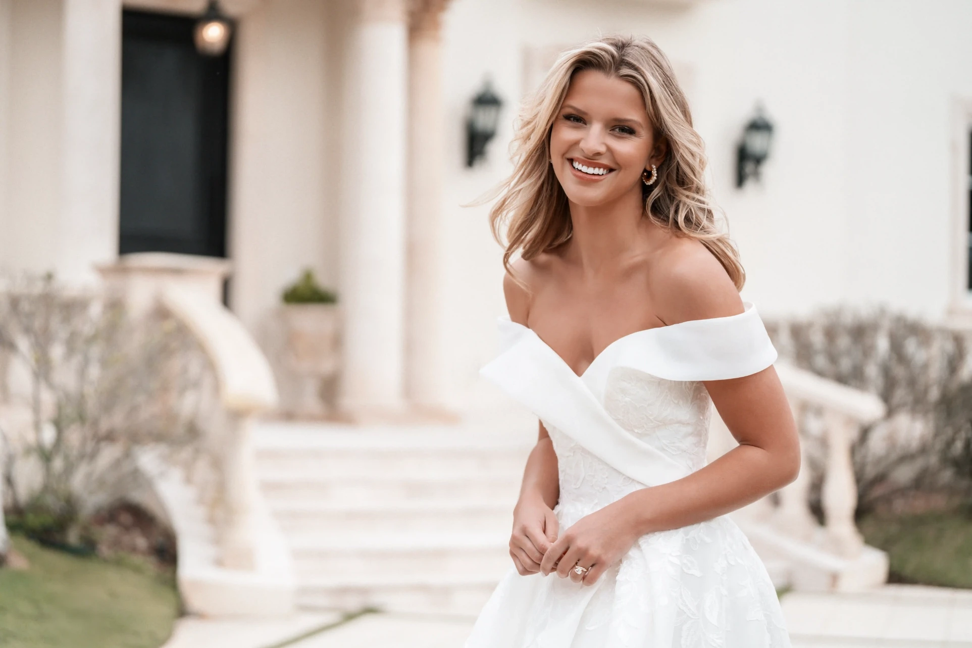 Model wearing a white Off The Shoulder Style Dress